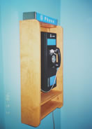 Wall phone booth in gameroom alcove