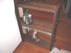 Bottom pull-out section of liquor cabinet