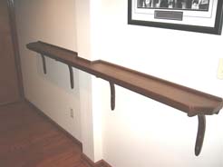 Drink rail on wall in pool table area