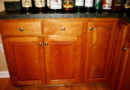 Double-hinged corner cabinet door