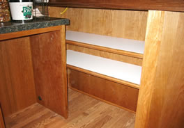 Adjustable melamine shelves under bar