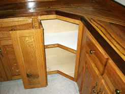 Double-hinged corner cabinet door