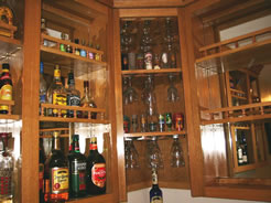 Angled glass racks in corner cabinet