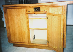 Outlet behind drop-down drawer front