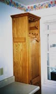 Tall corner pantry with top wine rack