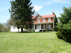 View of farmhouse from driveway