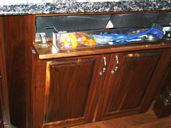 Sink front stainless steel tip-out drawer